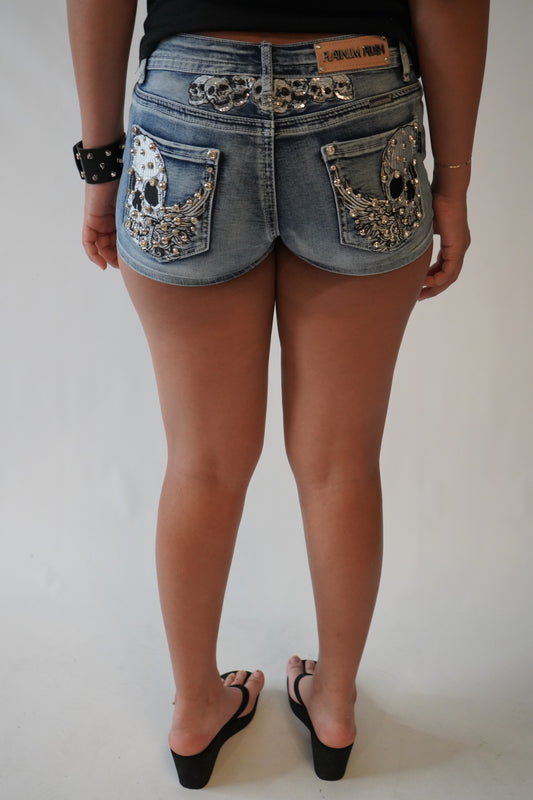 Tramp stamp skull shorts