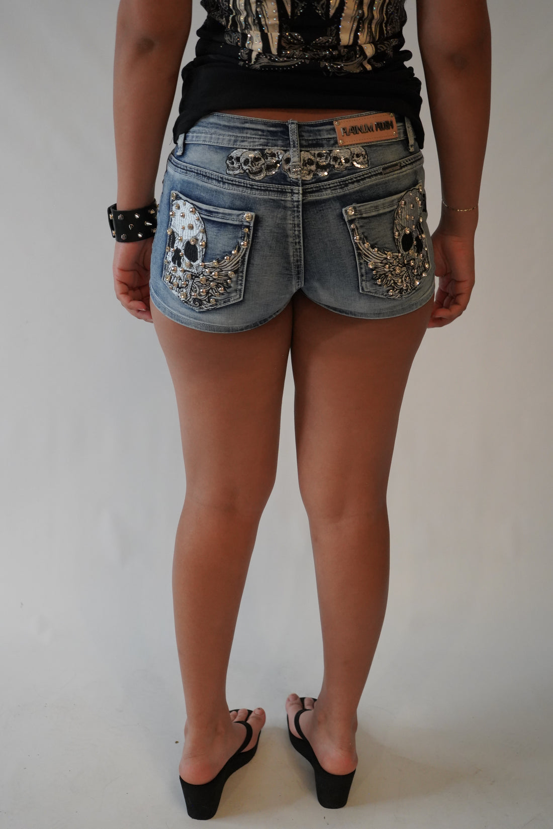 Tramp stamp skull shorts